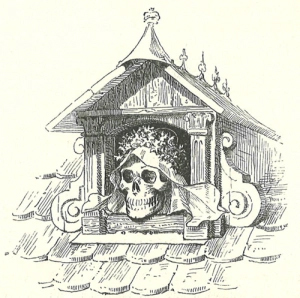 A skull wearing a bridal veil is set in a small window, looking out.